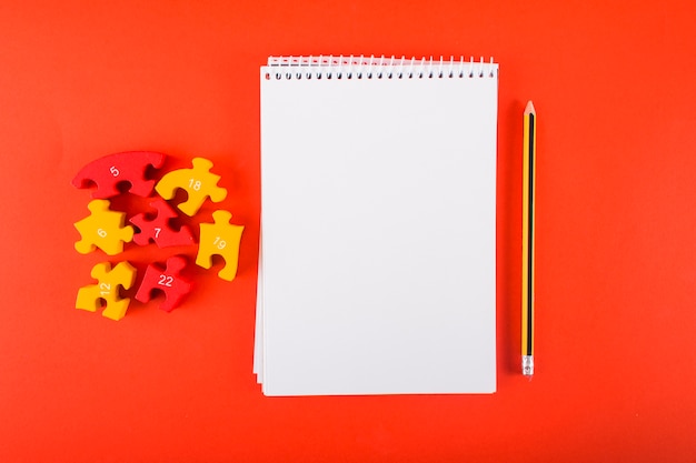 Blank notebook with puzzles on table