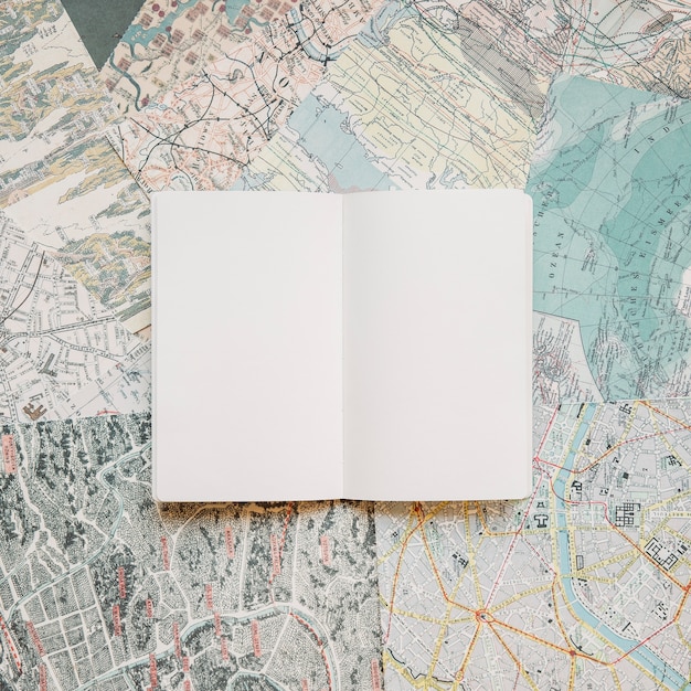 Free photo blank notepad on maps