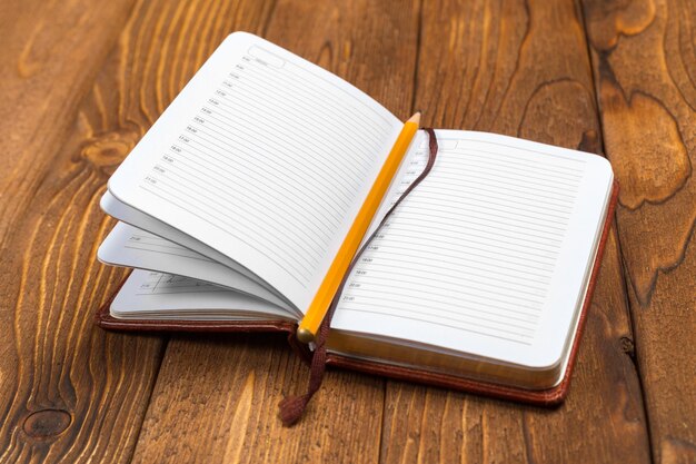 Blank notepad on office wooden table