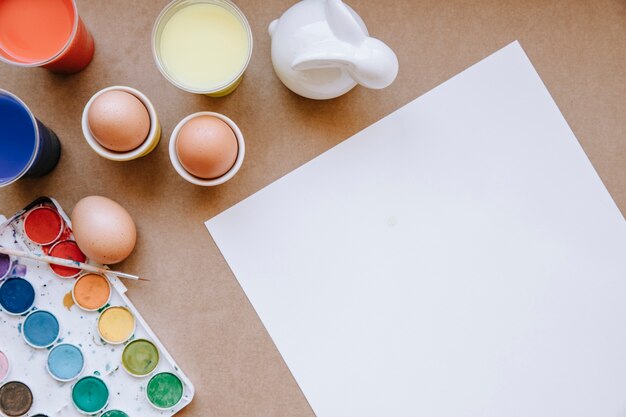 Blank paper and eggs with colors