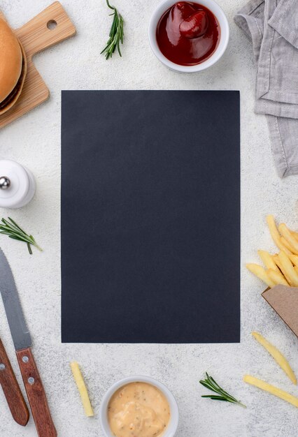 Blank paper sheet with hamburger and fries