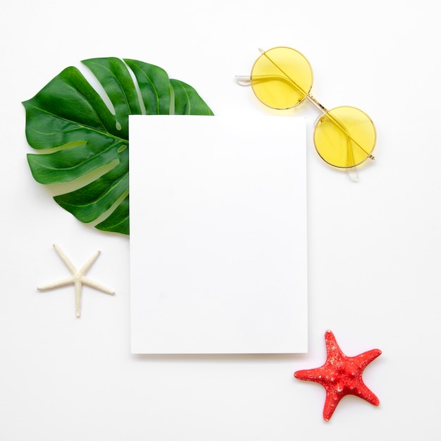 Free photo blank paper sheet with sunglasses