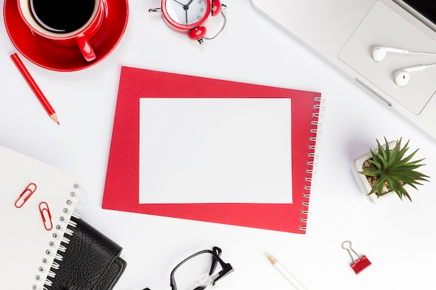 Blank paper on spiral notepad over the office desk