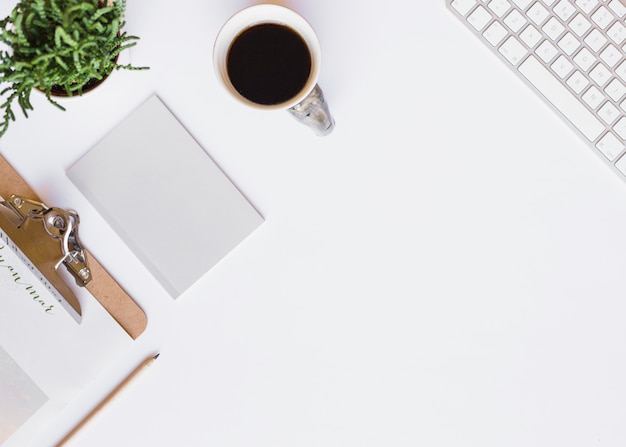 Free photo blank paper with coffee cup on table