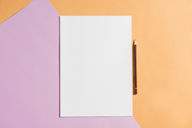 Blank paper with pencil on colorful card papers