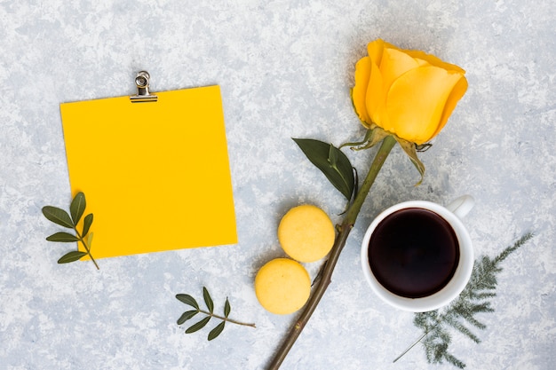 Blank paper with yellow rose flower and coffee