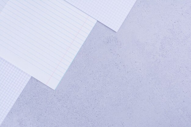 Blank papers isolated on grey.