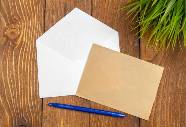 Blank Papers and Pen on Wooden Table