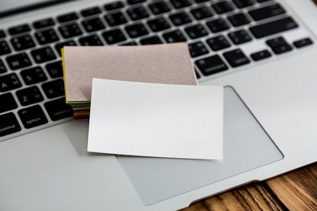 Free photo blank papers on top of a keyboard