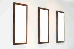 Free photo blank photo frame on wall