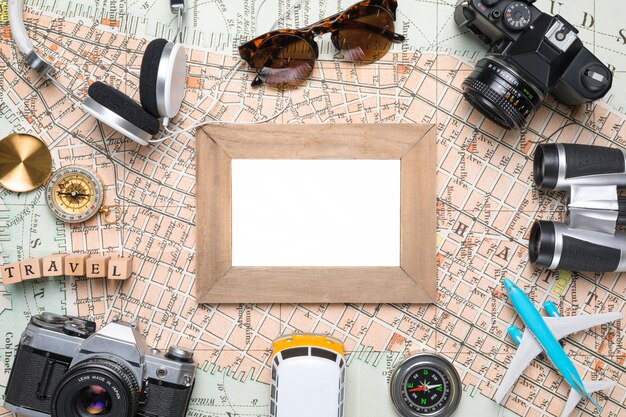 Blank picture surrounded by travel elements