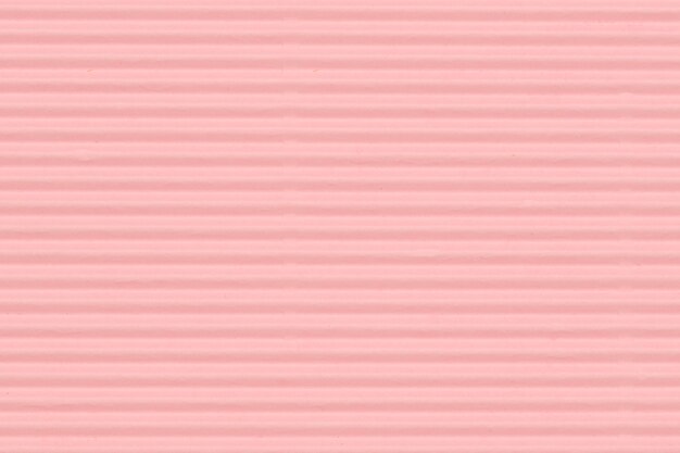 空白のピンクの波状の紙の壁紙の背景