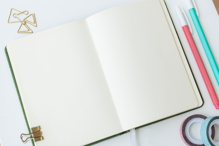 Free Photo blank plain notebook page with stationary