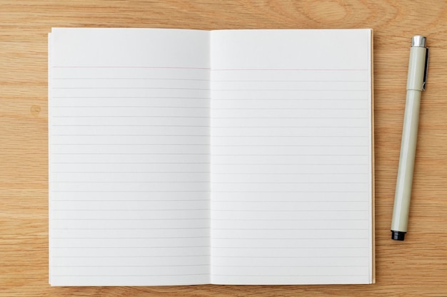 Blank plain white notebook page with a pen