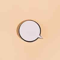 Free photo blank round speech bubble on beige background