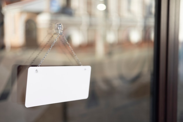 Blank sign on window still life