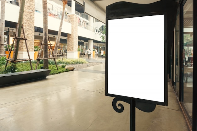 Blank sign with copy space for your text message or mock up content in modern shopping mall.