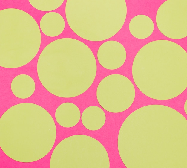 Blank small and big circles on pink background