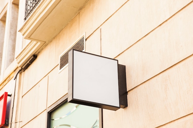 Free photo blank square sign on wall