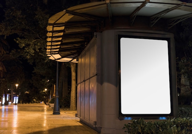 Blank white advertisement panel in city
