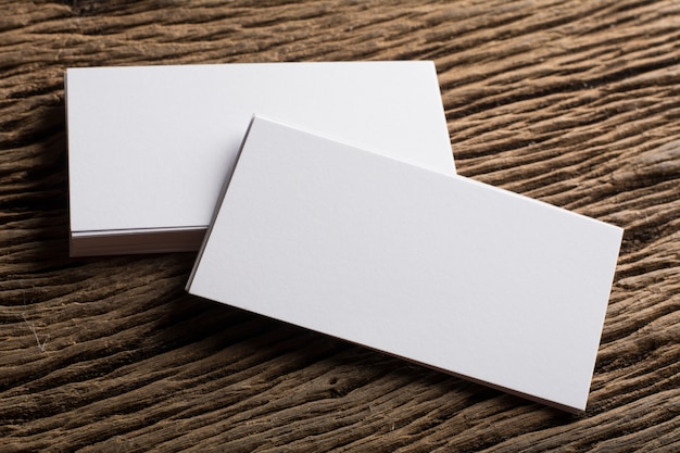 Free photo blank white business card presentation of corporate identity on wood background