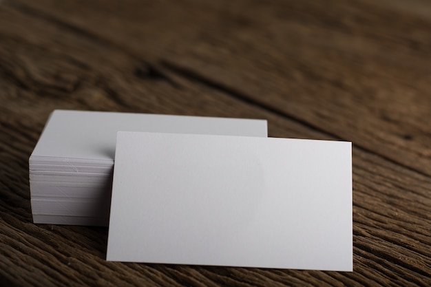 Free photo blank white business card presentation of corporate identity on wood background