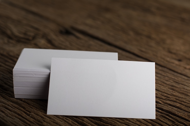 Free Photo blank white business card presentation of corporate identity on wood background