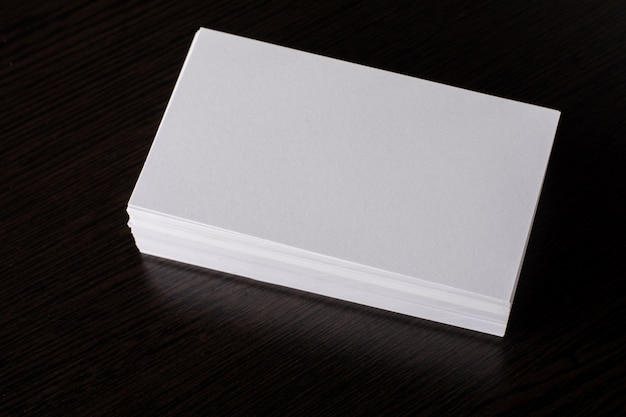 Free photo blank white business card presentation of corporate identity on wood background