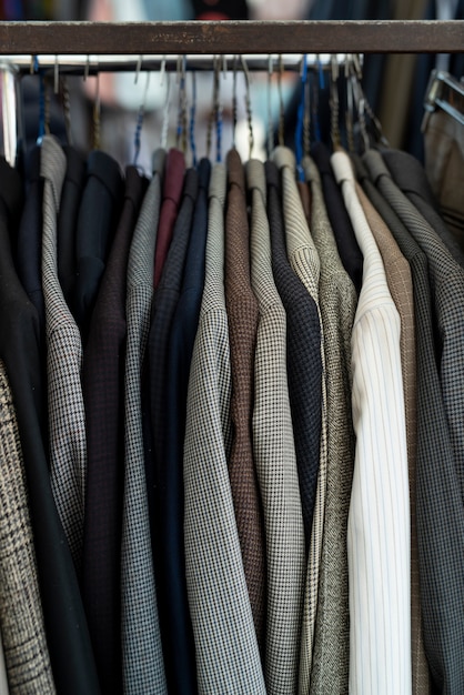 blazers on hangers at second hand market