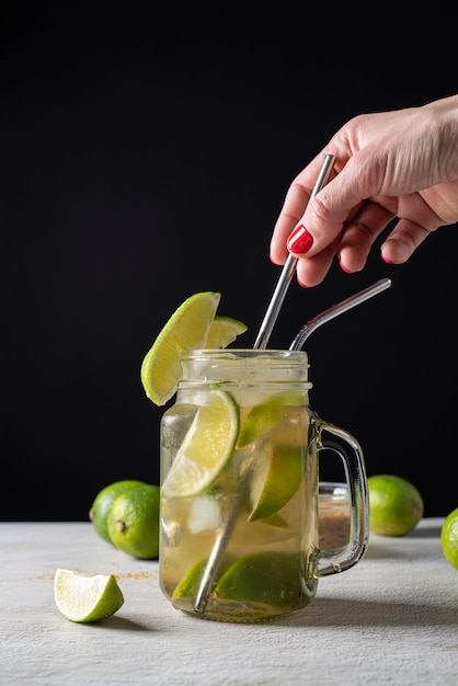 Blend of cocktail glass with ice and lime