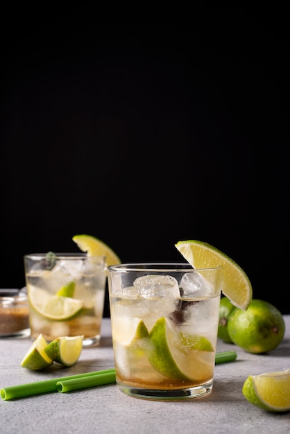 Blend of cocktail glasses with ice and lime