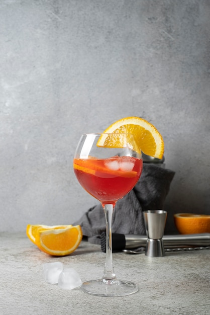 Blend of cocktails in glass with orange fruit