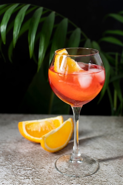 Free photo blend of cocktails in glass with orange fruit