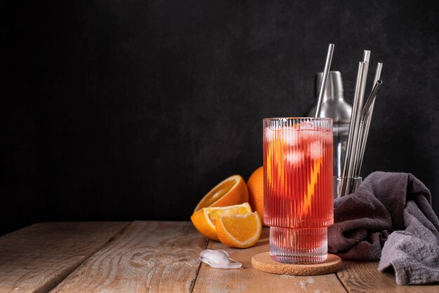 Blend of cocktails in glass with orange fruit
