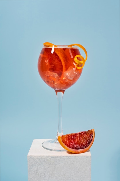 Blend of cocktails in glasses with ice cubes and blood orange