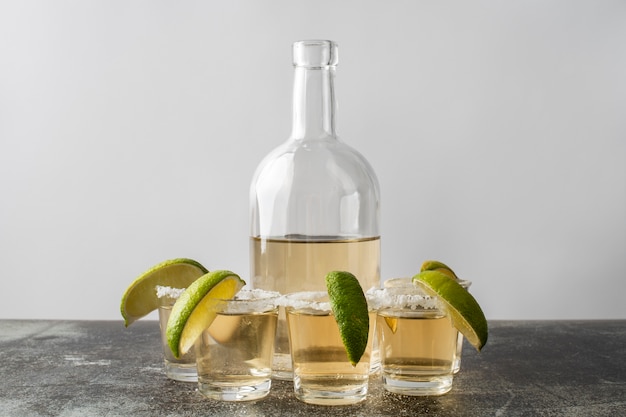 Blend of cocktails in glasses with lime and salty rims