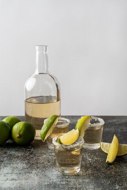 Blend of cocktails in glasses with lime and salty rims