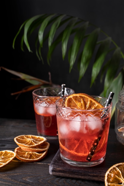 Blend of cocktails in glasses with orange fruit