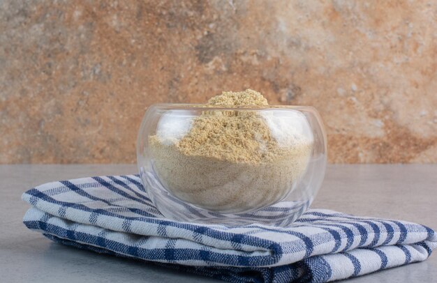 Blended sesame powder in a glass cup. 