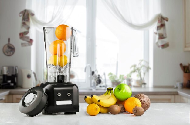 Blender and fruits on kitchen space. Still life