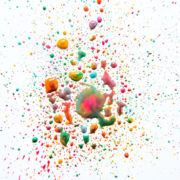 Free photo blending droplets of colored paint