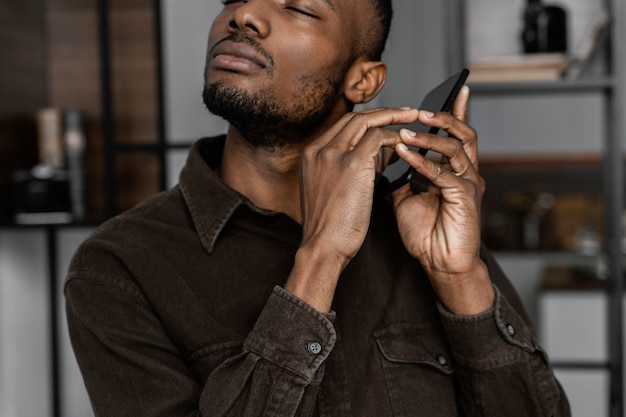 Blind man holding smartphone close up