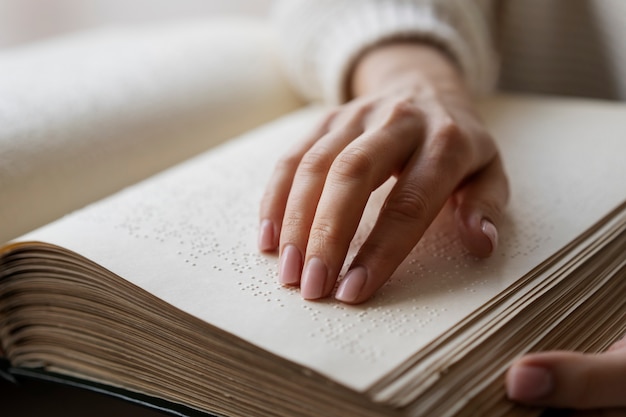 Blind person reading at home