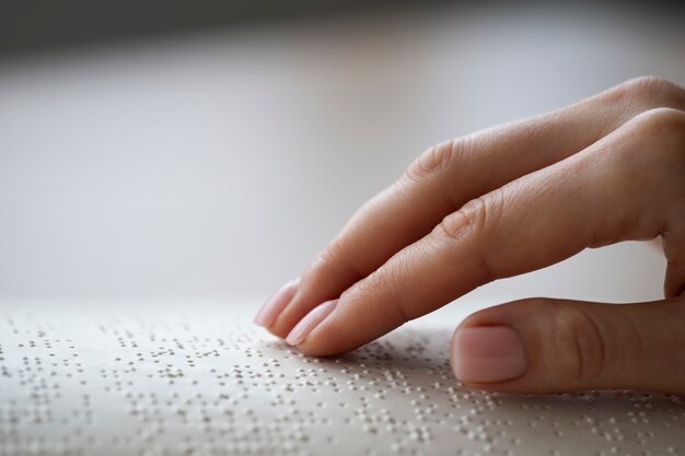 Blind person reading at home