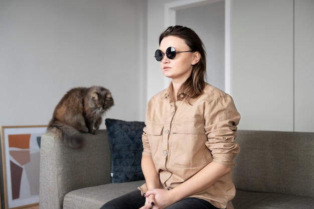 Blind woman sitting on the couch