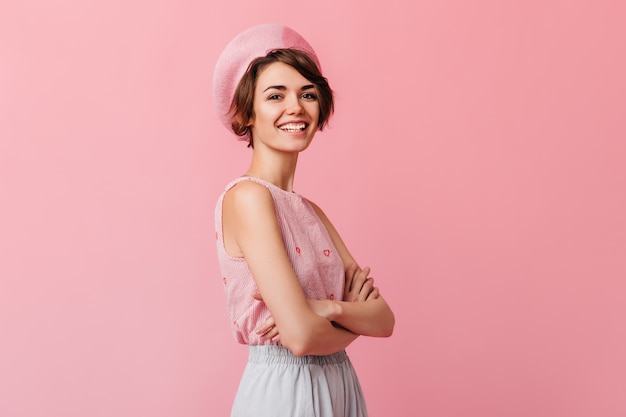 Blissful short-haired woman expressing positive emotions