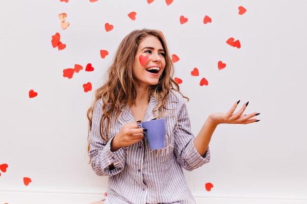 Blissful woman with black manicure enjoying morning