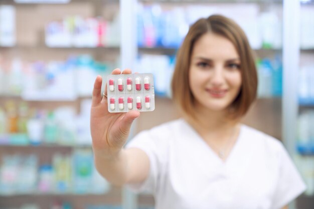 Blister pack of pills in female hands