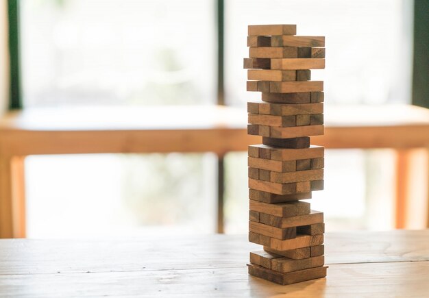 blocks wood game (jenga) on wooden table