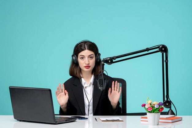 Blogger journalist girl cute young in black blazer recording speech on camera raising hands